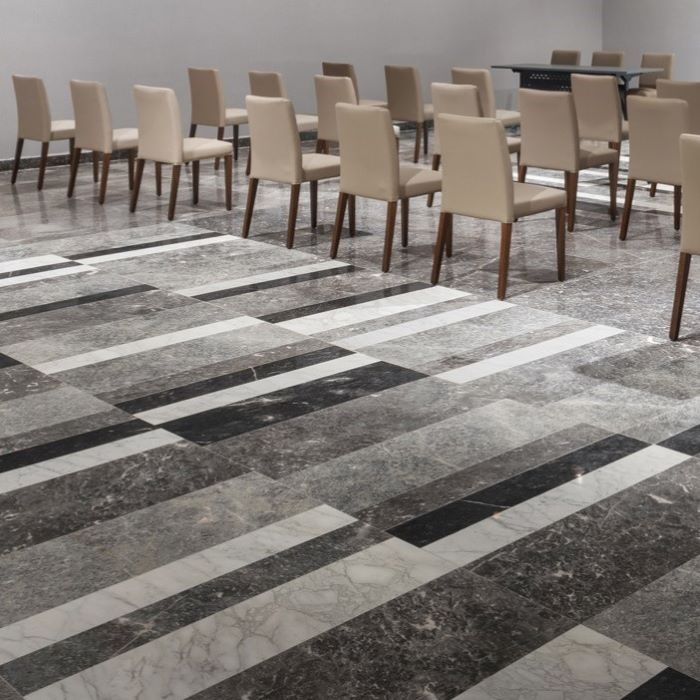 Conference room floor with white, black and grey marble from Alconera