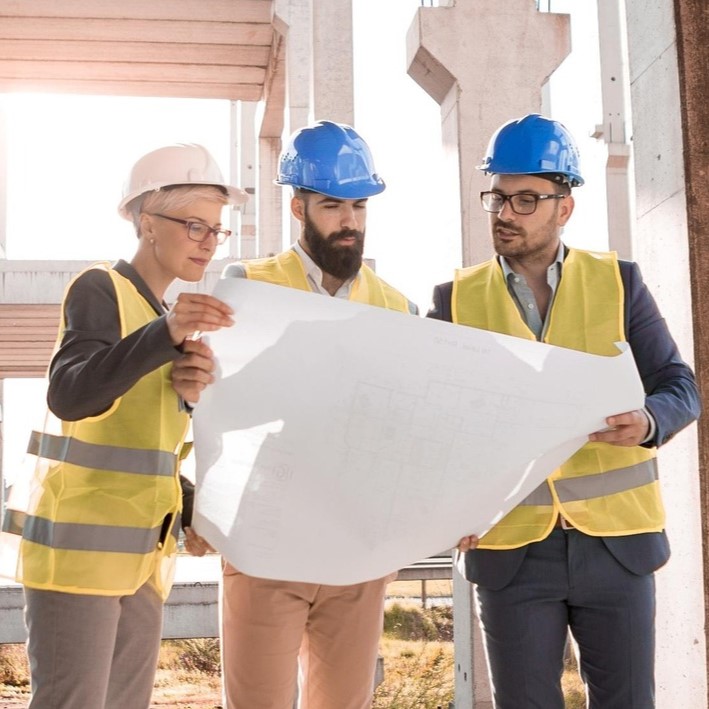 Photo from Pixabay showing investors reviewing plans on site, illustrating projects linked to marble quarries for sale in Spain.